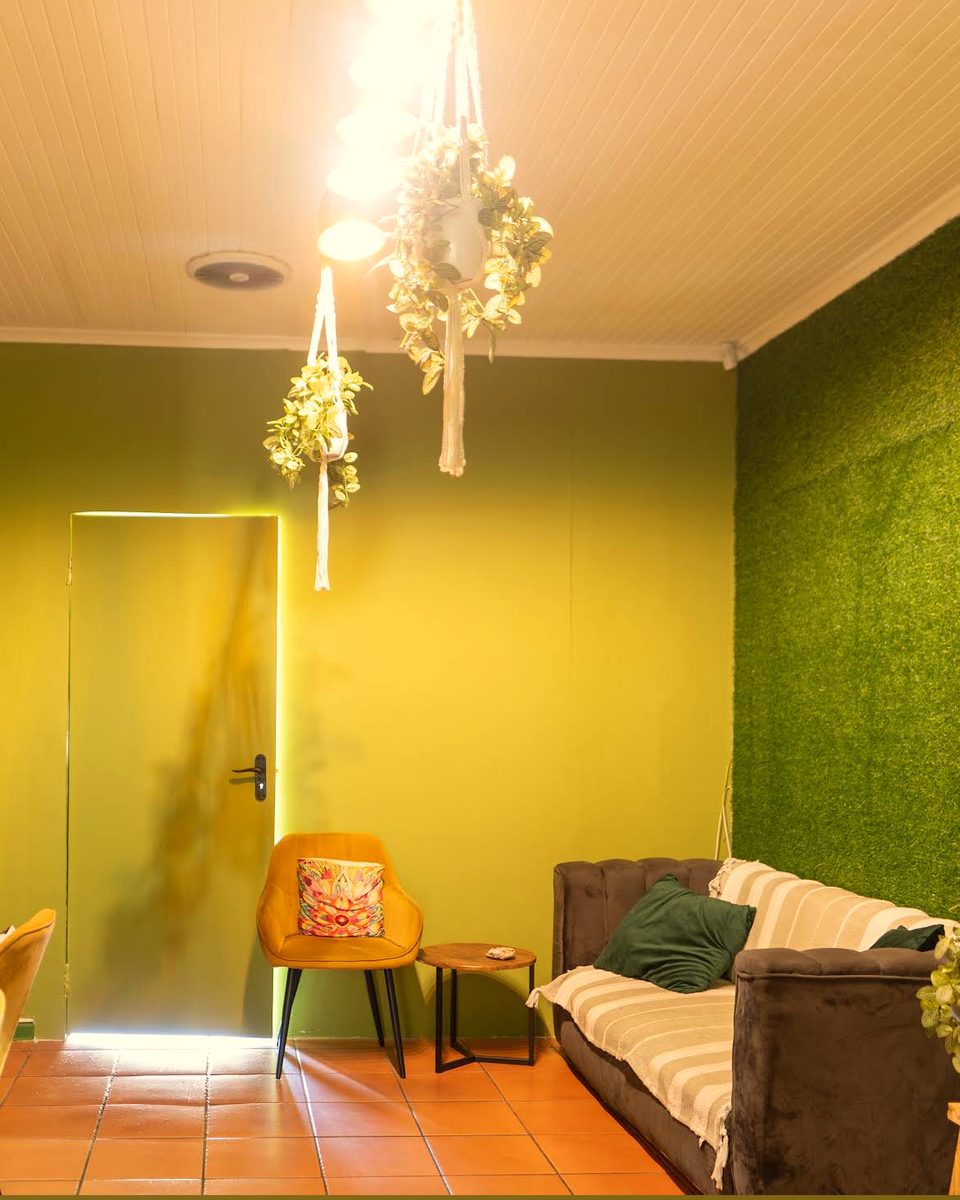 The warm lounge with its grass wall and soft seating