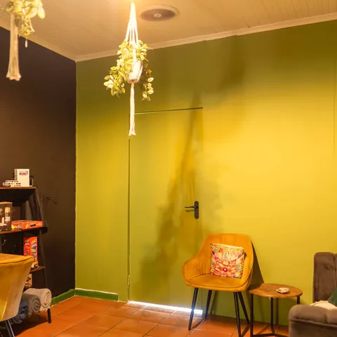 Mustard chair against olive wall